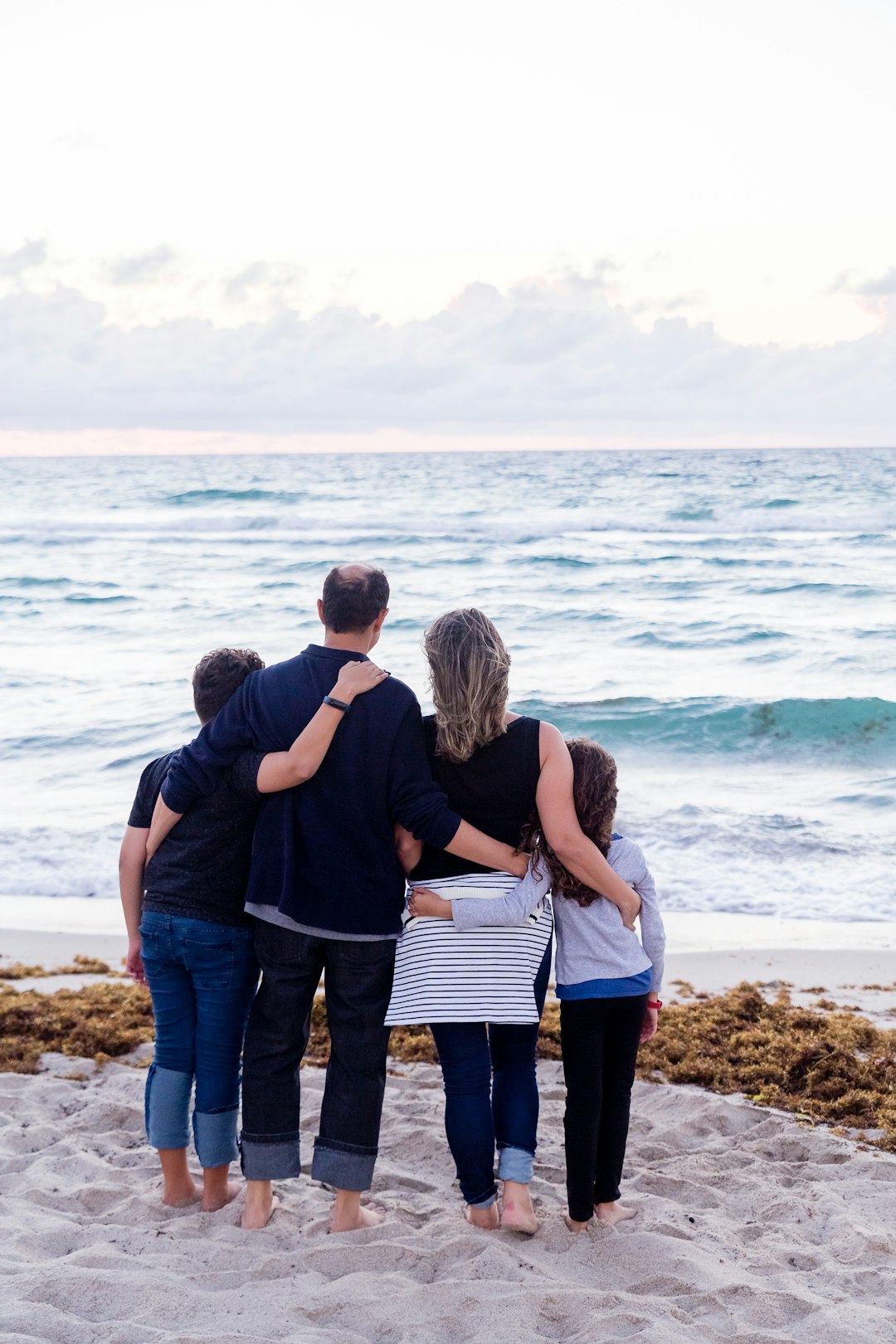 a-family-of-four-on-a-beach-6uywk8mdcwo